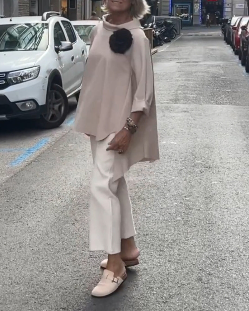 Elegancka bluzka o nieregularnym kroju i długich rękawach