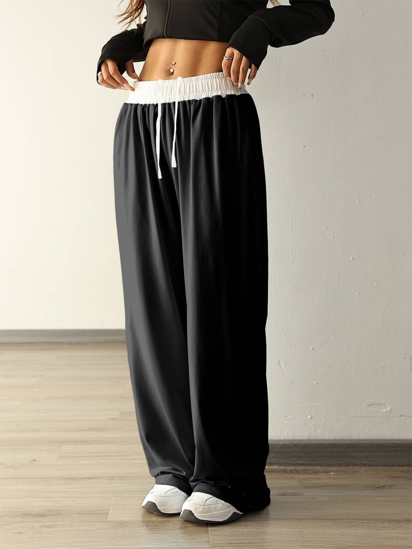 Nina | Wysokie elastyczne spodnie treningowe z kolorowymi blokami i kieszeniami