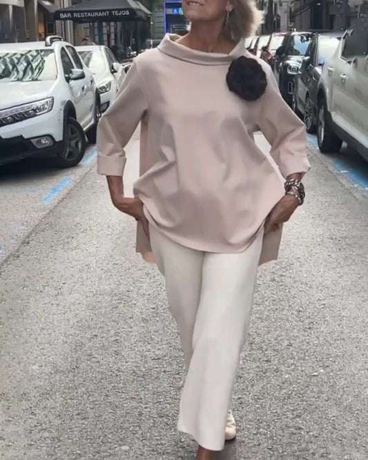 Elegancka bluzka o nieregularnym kroju i długich rękawach