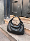 Woven handbag as a must-have